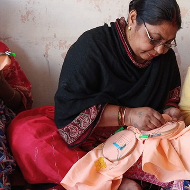 Rajni, an artisan with the PESHAS cluster, at her embroidery